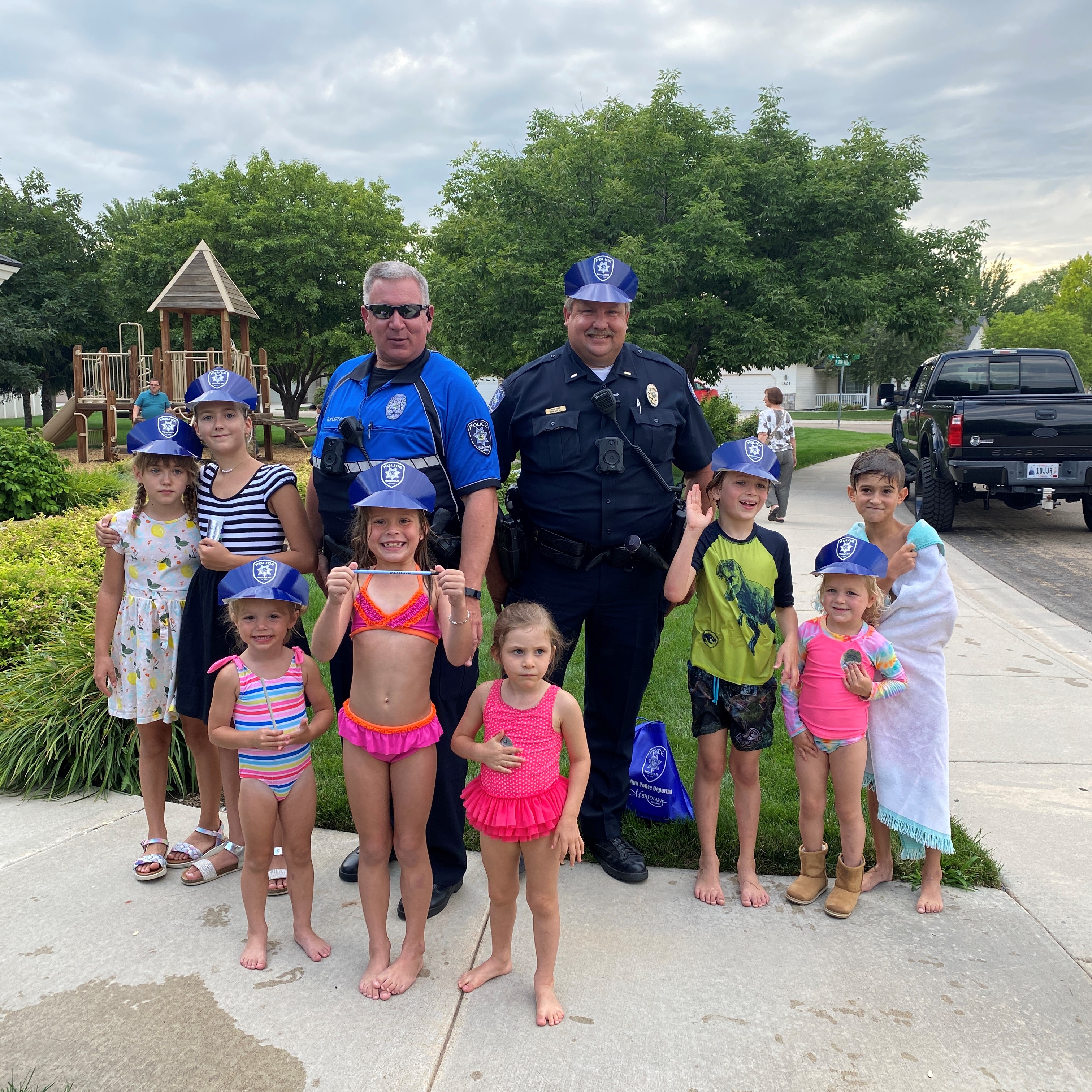 Police officers and a group of kids gathered for National Night Out.